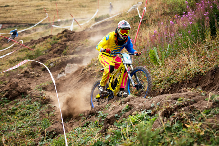 ALMATY, KAZAKHSTAN - AUGUST 22, 2015: J.Kumakbayev (N1) in action at Mountain Bike sports event DOWNHILL EXTREME WEEKEND.のeditorial素材