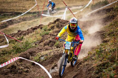 ALMATY, KAZAKHSTAN - AUGUST 22, 2015: J.Kumakbayev (N1) in action at Mountain Bike sports event DOWNHILL EXTREME WEEKEND.のeditorial素材