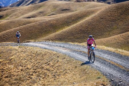 ALMATY, KAZAKHSTAN - SEP 06, 2015: I.Popov (N13) in action at Adventure mountain bike cross-country competition in mountains "Bartogay Marathon 2015"のeditorial素材