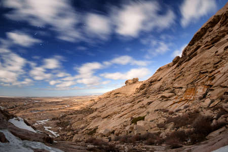 Night  with full moon light in desert mountains Bektau-Ata, Kazakhstan, Central Asia.