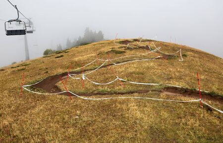 ALMATY, KAZAKHSTAN - AUGUST 23, 2015: Marking downhill race on slope at Mountain Bike sports event DOWNHILL EXTREME WEEKEND.のeditorial素材