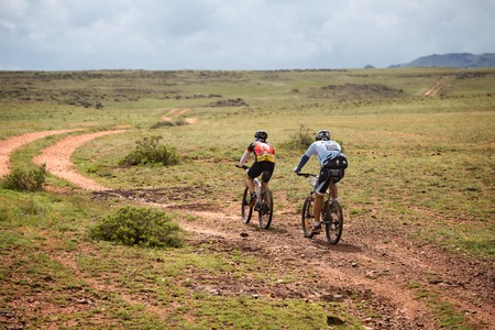 ALMATY, KAZAKHSTAN - APRIL 30, 2016: Two unknown riders in action at Adventure mountain bike cross-country competition in mountains "Jeyran Trophy 2016"のeditorial素材