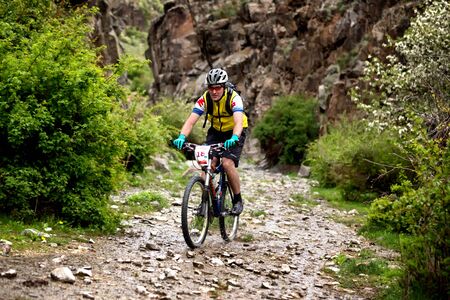 ALMATY, KAZAKHSTAN - MAY 01, 2016: E.Asafov (N18) in action at Adventure mountain bike cross-country competition in mountains "Jeyran Trophy 2016"のeditorial素材