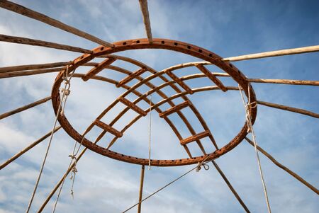 Shanyrak - The wooden crown of the yurt. Yurt - portable, bent dwelling structure traditionally used by nomads in the steppes of Central Asia as their home.の写真素材