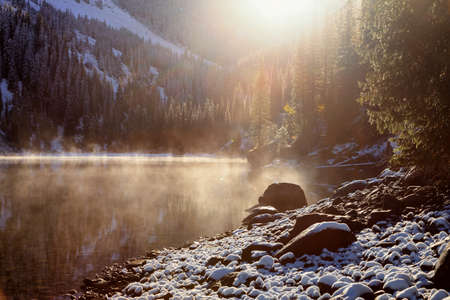 Morning after the first snowfall on the lake Kolsai, Tien-Shan mountains, Kazakhstanの写真素材