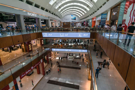 Dubai, UAE - 12.01.2019: People walking by and shopping inside of the Dubai Mall. Several shopping floors, busy as usual.のeditorial素材