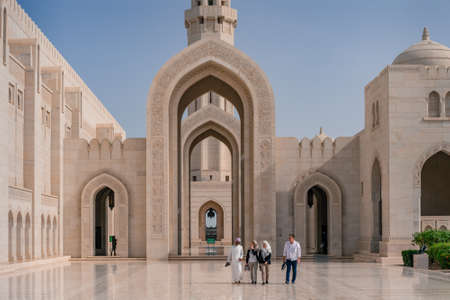 Muscat, Oman - 04.04.2018: Tourists walking in the courtyard of the Sultan Qaboos Grand Mosque, Muscat, Oman.のeditorial素材