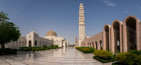 Muscat,Oman - 04.04.2018: Marble courtyard of Sultan Qaboos Grand Mosque. Minaret, dome and arches.のeditorial素材