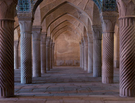 Symmetrical spiral columns in a hall of Vakil mosque in Shiraz, Iran. Beautiful symmetrical design.の写真素材