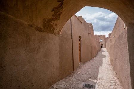 Narrow streets of ancient persian city built from mud bricks. Rayen Citadel, Mahan, Iran, Persia.の写真素材