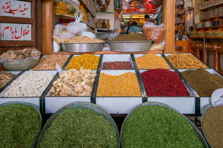 Kerman, Iran - 04.19.2019: Colorful grains and spices in front of a spice shop in persian bazaar.のeditorial素材