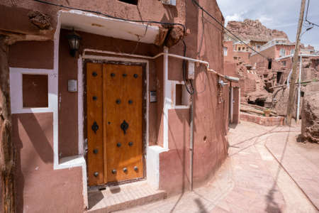 Streets of famous old Iranian village of Abyaneh. Barzrud Rural District, in the Central District of Natanz County, Isfahan Province, Iran. Red clay buildings. Mud bricks.の写真素材