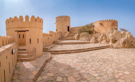 Nakhal,Oman - 04.01.2018: Yard inside the medieval arabian fort of Nakhal, Oman. Fortification walls, rock, stone floor, blue sky. Medieval middle east castle.のeditorial素材