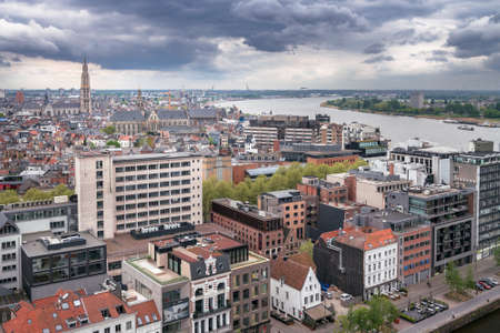 Antwerp, Belgium - 04.29.2018: View of the city from above on a cloudy, rainy day. Dramatic clouds...