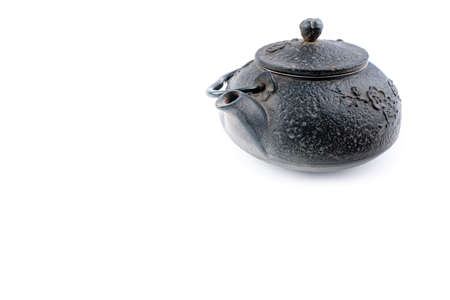 Vintage, black metal Japanese tea pot isolated on white background. Stylish kitchen equipment. Minimalistic tea ceremony conceptの写真素材