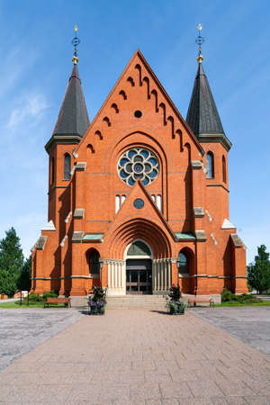 Red brick building of the Sankt Petri Kyrka, or Saint Peter Church, in Vastervik, Sweden, on a sunny summer day.のeditorial素材
