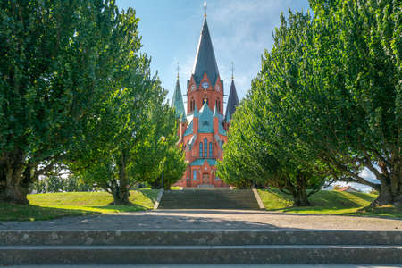 Red brick building of the Sankt Petri Kyrka, or Saint Peter Church, in Vastervik, Sweden, on a sunny summer day.のeditorial素材