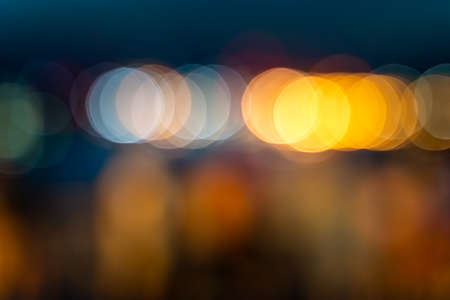 Colorful harbor lights out of focus create an interesting abstract pattern. Pattern of warm color circles.の写真素材