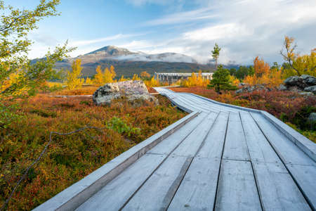 Vietas, Sweeden - 09.16.2021: Modern wooden building of Visitor Center Laponia in Stora Sjofallet, Stuor Muorkke National Park in Swedish Lapland. Beautiful autumn colors in remote arctic landscape.のeditorial素材