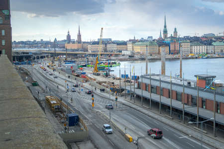Stockholm, Sweden - 04.15.2017: Cityscape of Stockholm viewed from the port with a busy road in the front.のeditorial素材