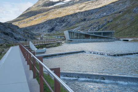 Trollstigen, Norway - 09.11.2017: Modern triangle building of Trollstigen cafe and visitor center on a cold day of early autumn. Modern contemporary architecture in dramatic Norwegian landscape.のeditorial素材