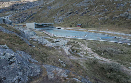 Trollstigen, Norway - 09.11.2017: Modern triangle building of Trollstigen cafe and visitor center on a cold day of early autumn. Modern contemporary architecture in dramatic Norwegian landscape.のeditorial素材