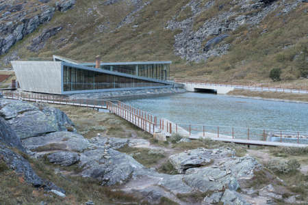 Trollstigen, Norway - 09.11.2017: Modern triangle building of Trollstigen cafe and visitor center on a cold day of early autumn. Modern contemporary architecture in dramatic Norwegian landscape.のeditorial素材
