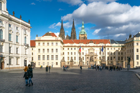 Prague, Czechia - 02.19.2022: People walking in front of the main gate of Prague Castle on a beautiful sunny day.のeditorial素材
