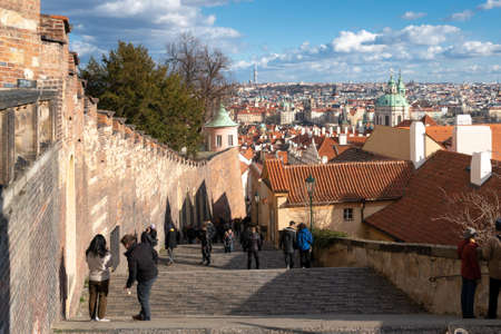 Prague, Czechia - 02.19.2022: People walking in the Zamecke schody pathway under Prague Castle in...