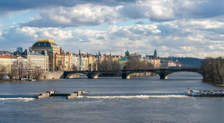 Prague, Czechia - 02.19.2022: Cityscape with Vltava river and National Theater in the back viewed from Charles Bridge on a nice day of winter. Historical center of Prague. Famous european capital.のeditorial素材