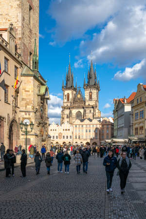Prague, Czechia - 02.19.2022: Lot of people walking in the Old Town Square with Church of Our Lady before Tyn in the background. Crowds in he historical center of Prague on a sunny day.のeditorial素材
