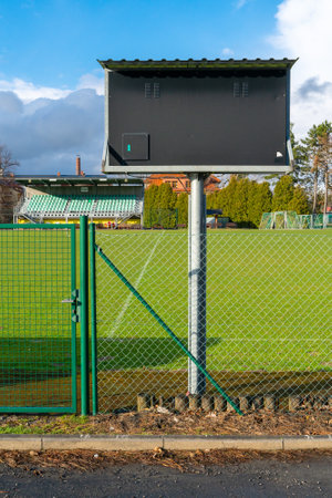 Celadna, Czechia - 04.10.2022: Village soccer field of a minor league on a nice sunny day of spring. Fence in front. Amateur sport arena. Soccer pitch outdoorsのeditorial素材