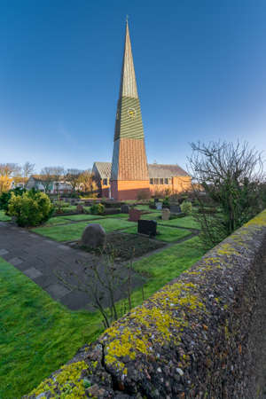 Helgoland, Germany - 02.27.2022: Slim tall pyramid of the modern Christian church in German island...
