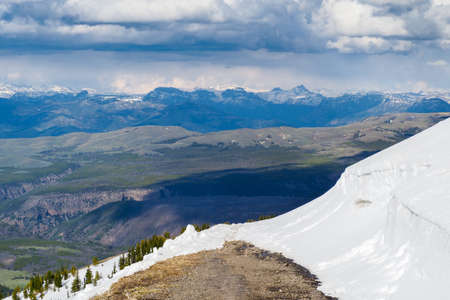 View from the slopes of Mt.Washburn in Yellowstone National Park, Wyoming, USA with vast mountain landscape in the back. Nice day hiking in the mountains.の写真素材