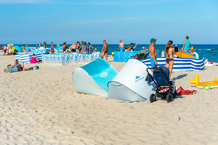 Hel, Poland - 08.04.2022: The big beach, duza plaza in Polish, full of people on a nice sunny summer day at the Baltic coast. Summer vacation by the sea in Poland.のeditorial素材