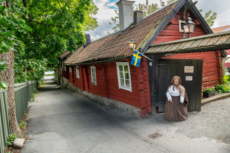 Sigtuna, Sweden - 09.02.2022: Very old red traditional wooden house in the side street of Sigtuna, the oldest town in Sweden. Tant Bruns Kaffestuga.のeditorial素材