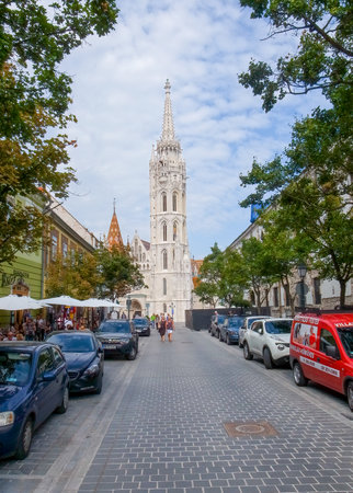 Budapest, Hungary - 08.15.2015: Narrow street leading to The Church of the Assumption of the Buda Castle, Nagyboldogasszony-templom, more commonly known as the Matthias Church.のeditorial素材