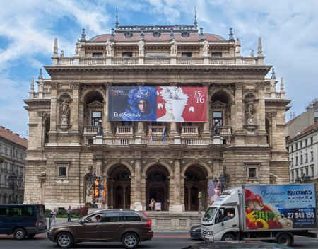 Budapest, Hungary - 15.05.2015: Frontal shot of Budapest Opera building with cars passing in front of it in rush hour.のeditorial素材