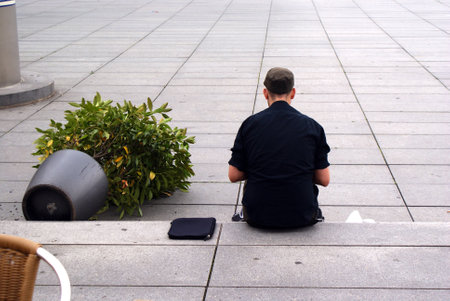 Young man and flowerの写真素材