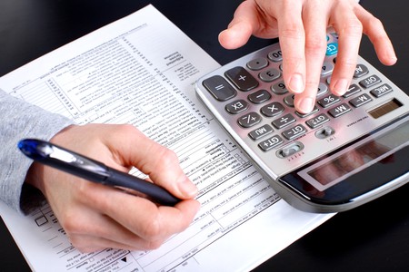 Accountant filling the forms out.

の写真素材