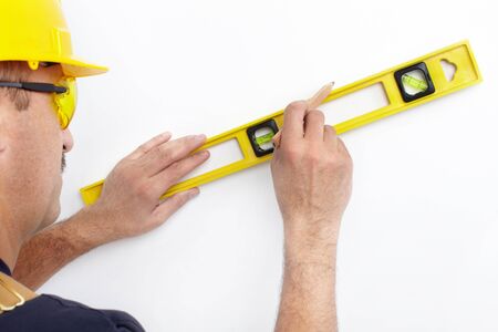 Mature contractor  working. Over white background