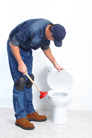 Plumber with a toilet plunger 
の写真素材