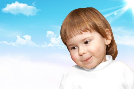 The small girl looks  The sky and clouds