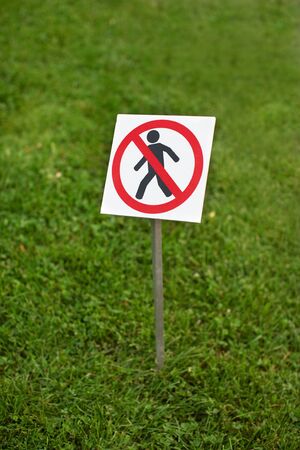 Botanical garden. The sign on a lawnの写真素材