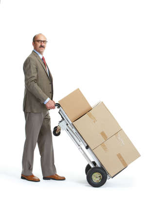 Businessman with a handcart on a white backgroundの写真素材