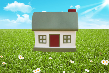 Green grass and little cottage. The toyの写真素材