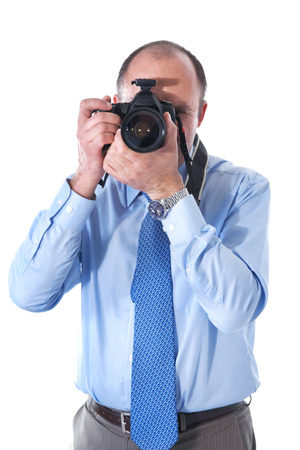 The photographer and reflex camera in photographic studioの写真素材