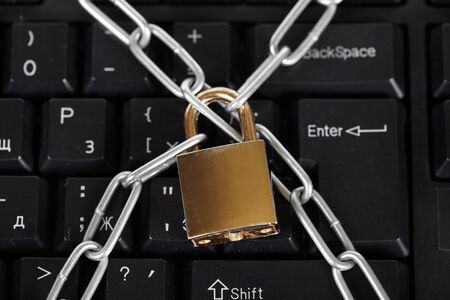 Lock and black keyboard.  Interdiction and chain