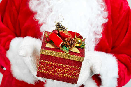 Hands of Christmas  Santa Claus with gift