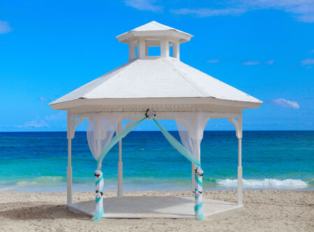 White wooden Gazebo on the tropical beach.の写真素材